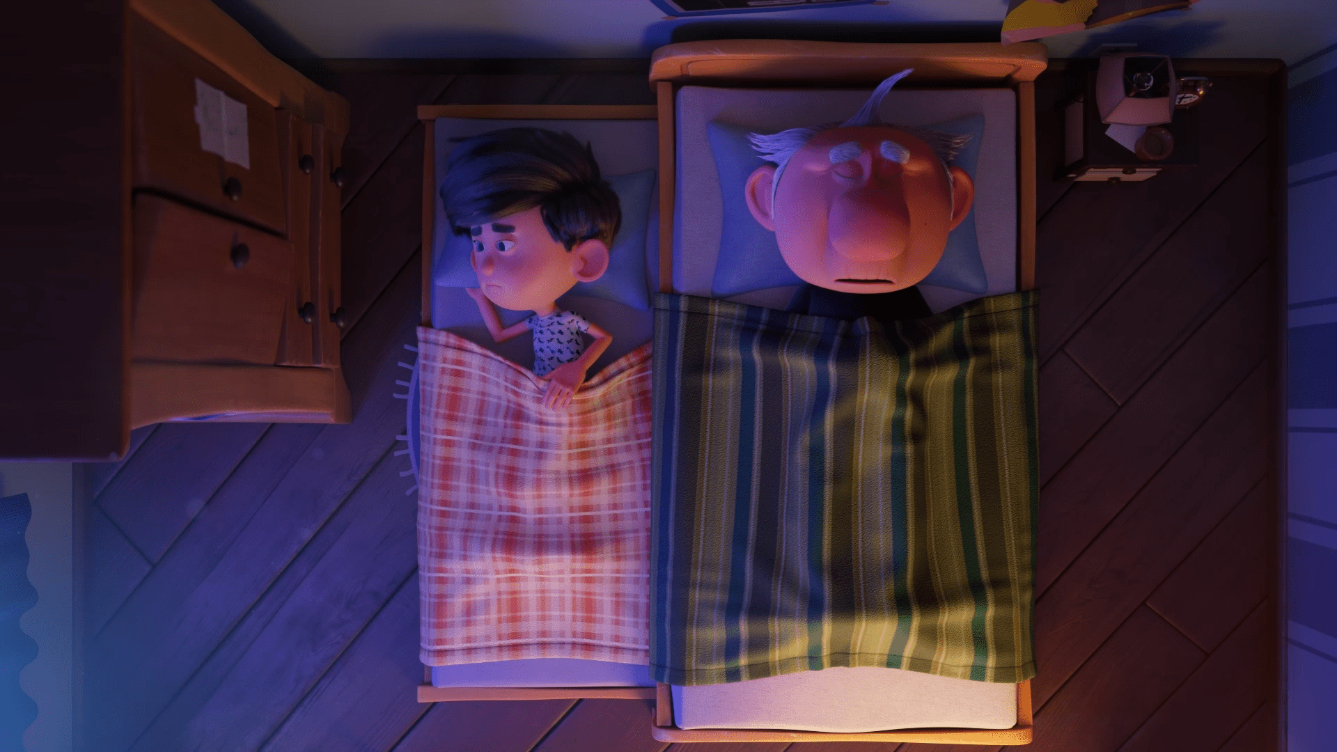 Avô e neto estão dormindo lado a lado, cada um em sua cama.