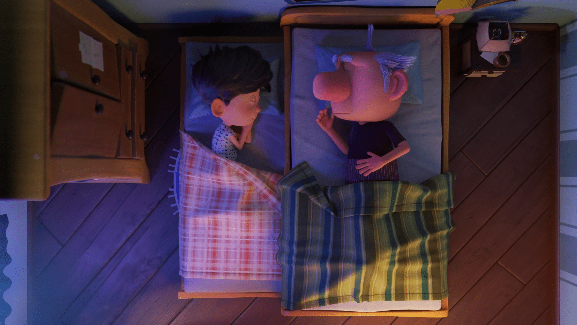 Avô e neto estão dormindo lado a lado, cada um em sua cama.